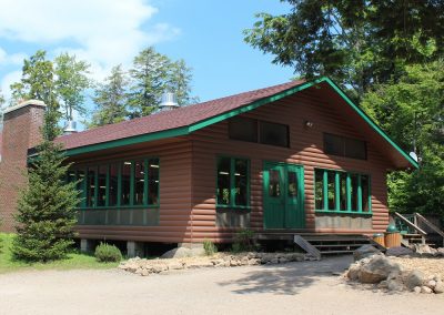 An image of the exterior of the Boyes Lodge Dining Hall at the Wenonah Outdoor Education Centre.