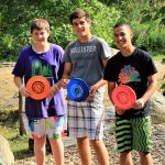 Students play Frisbee Golf program during school group visit activities at Wenonah Outdoor Centre in Muskoka